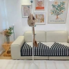 A simple floor-standing bedside coat rack for home use, a light luxury cream-style clothes hanger, a popular online celebrity standing indoor clothes rack Application Scenario